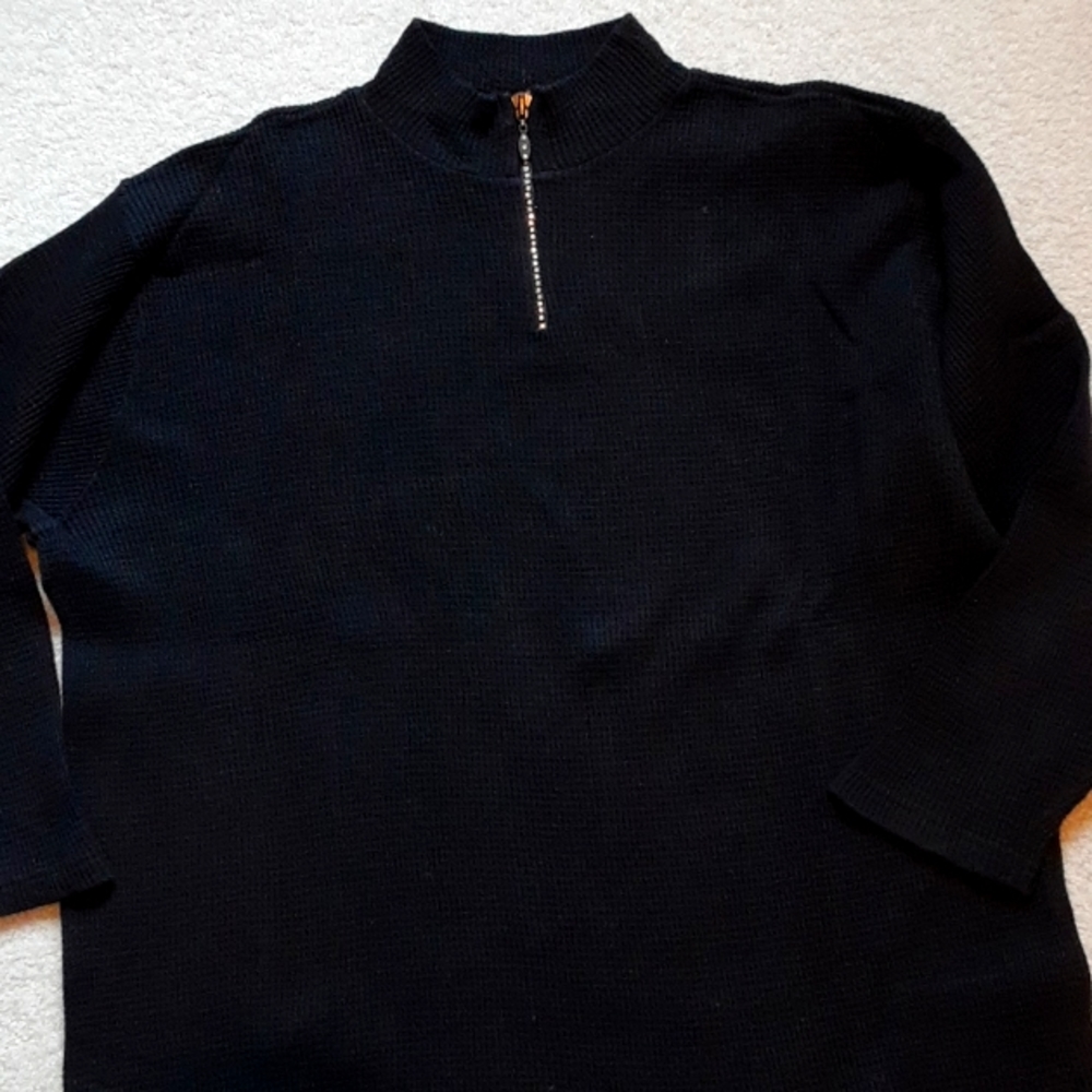 Long-sleeve black top with diamond studs at front zipper